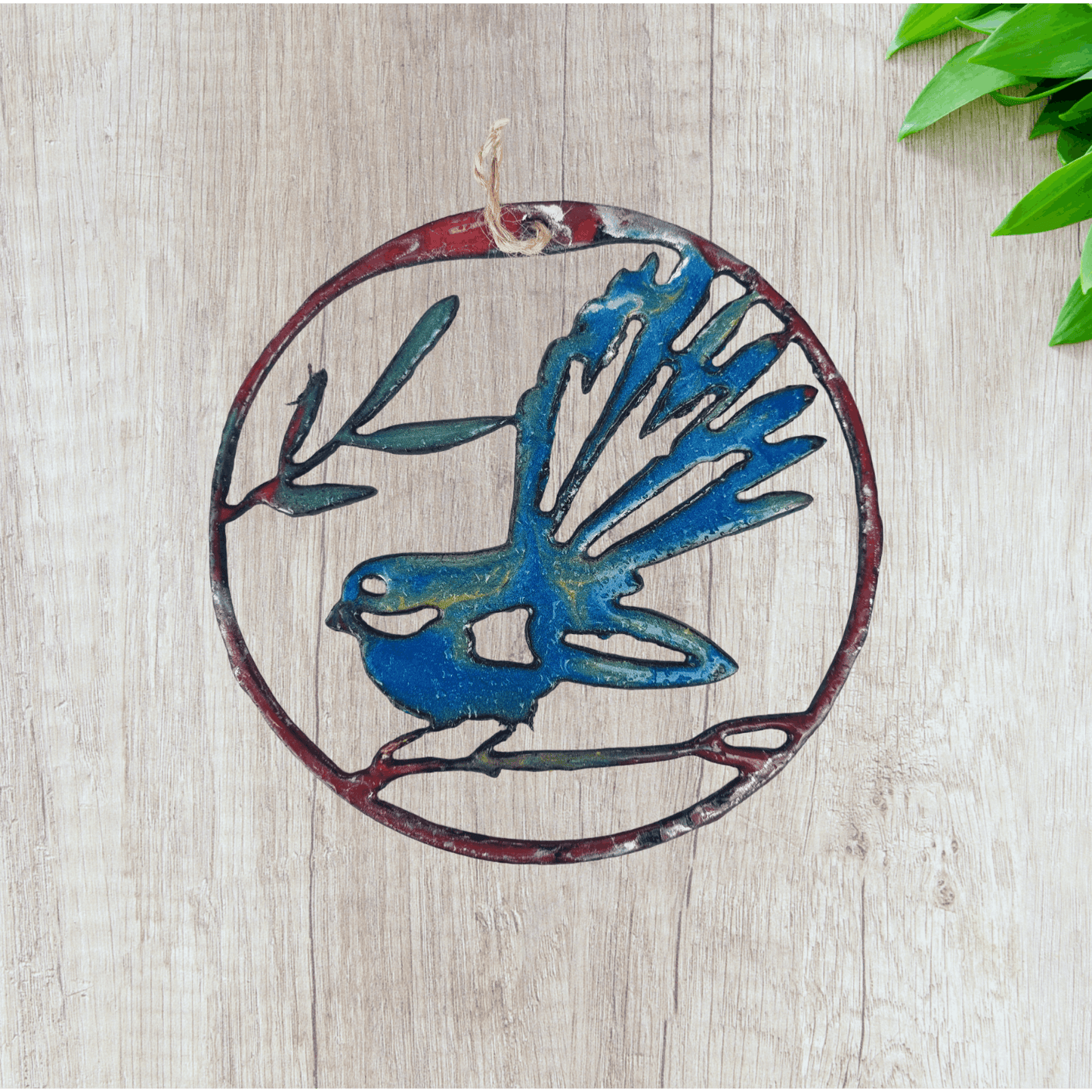 llarge fantail circle wall metal art coated in pourable epoxy 180mm dia
