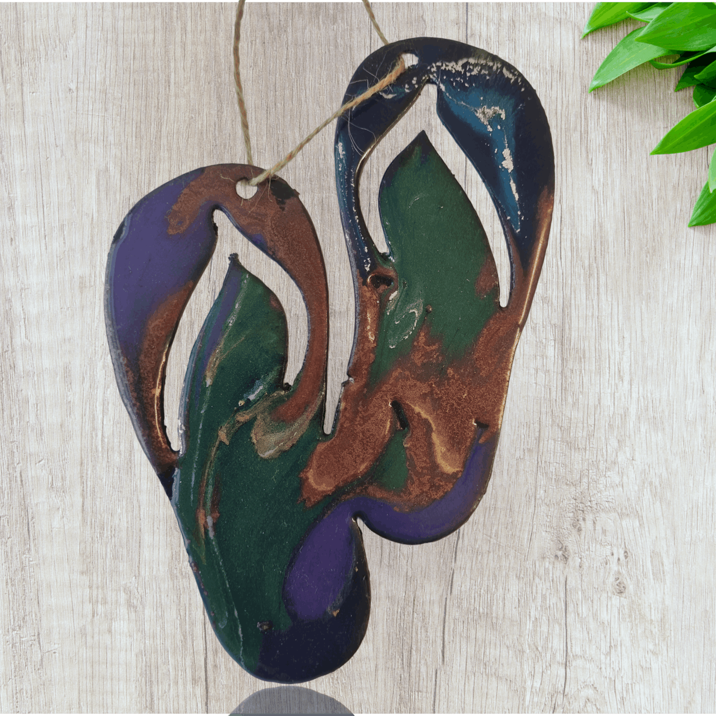 Jandals metal art coated in pourable epoxy 130,mm x 160mnm