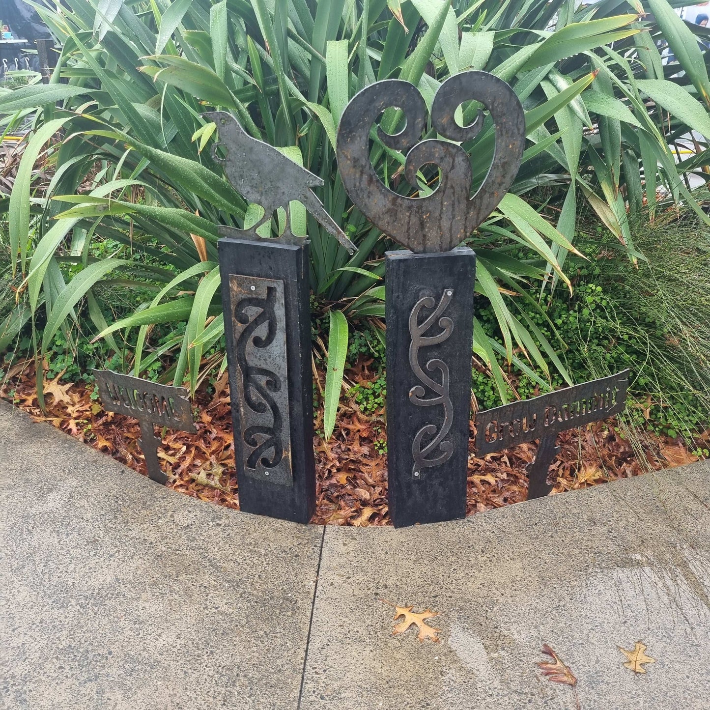 Corten koru heart on black stained Post-Garden Art