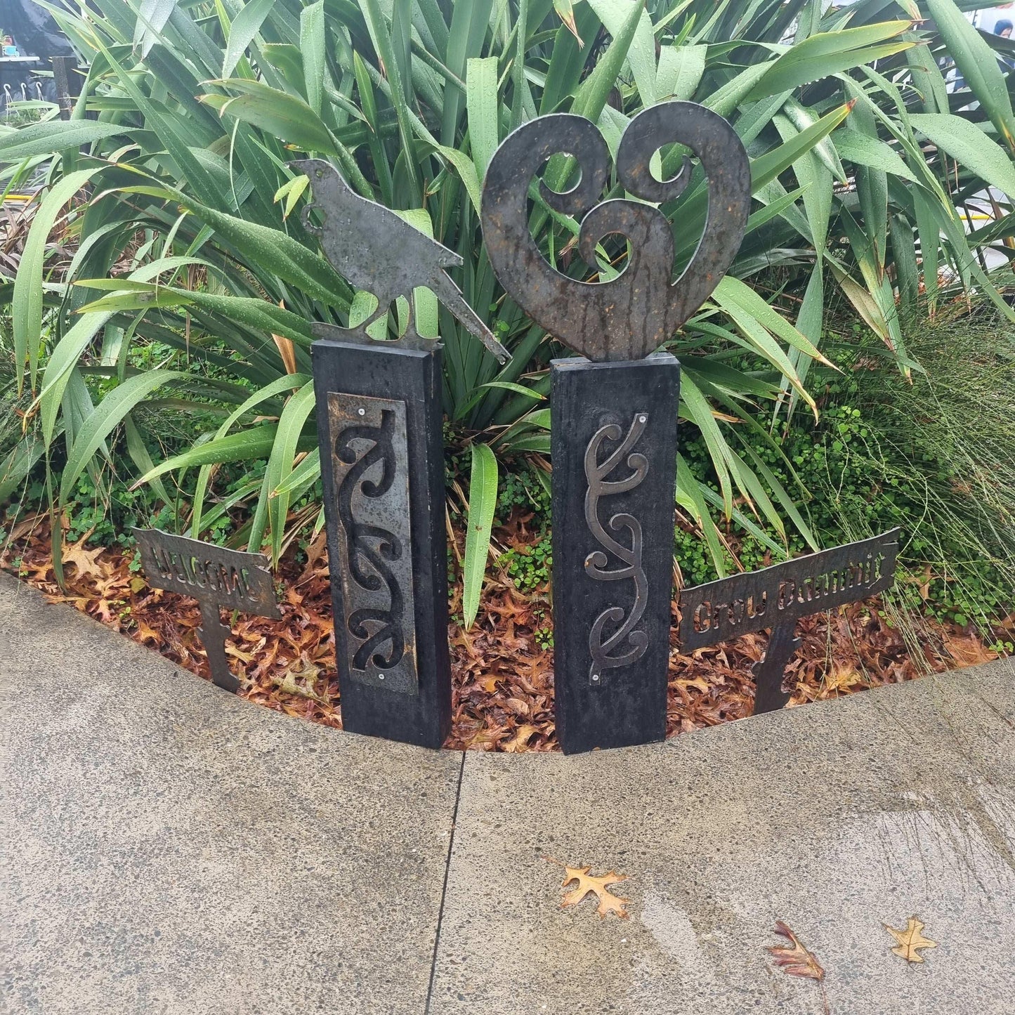 Corten koru heart on black stained Post-Garden Art - Vintique Concepts