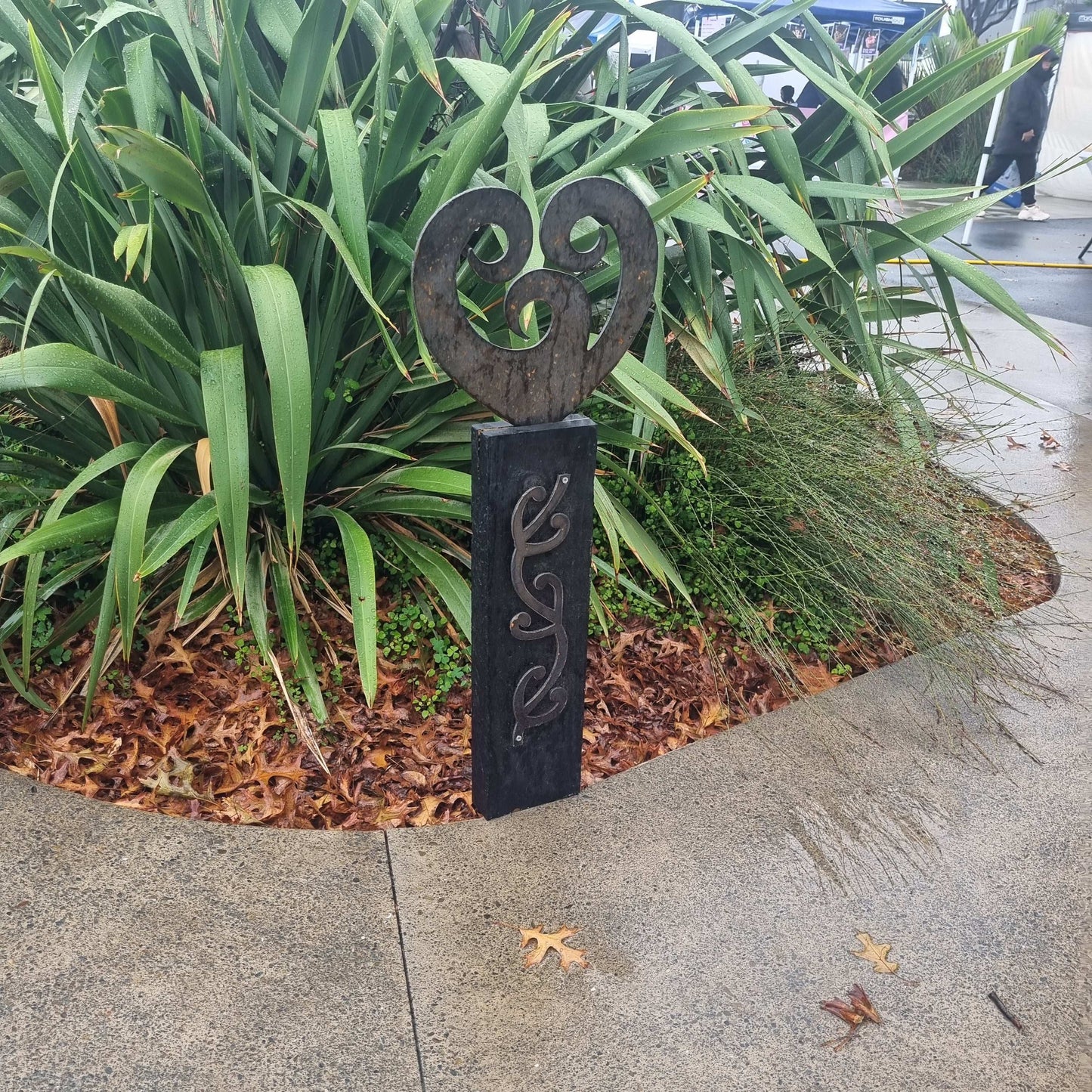 Corten koru heart on black stained Post-Garden Art