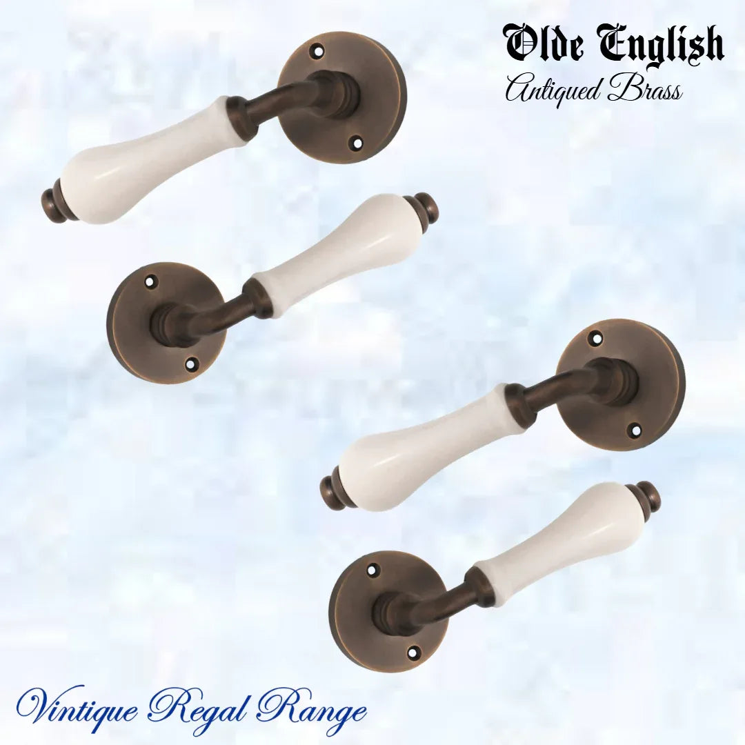 Antiqued Brass Olde English with Ivory Porcelain lever door handle - Vintique Concepts