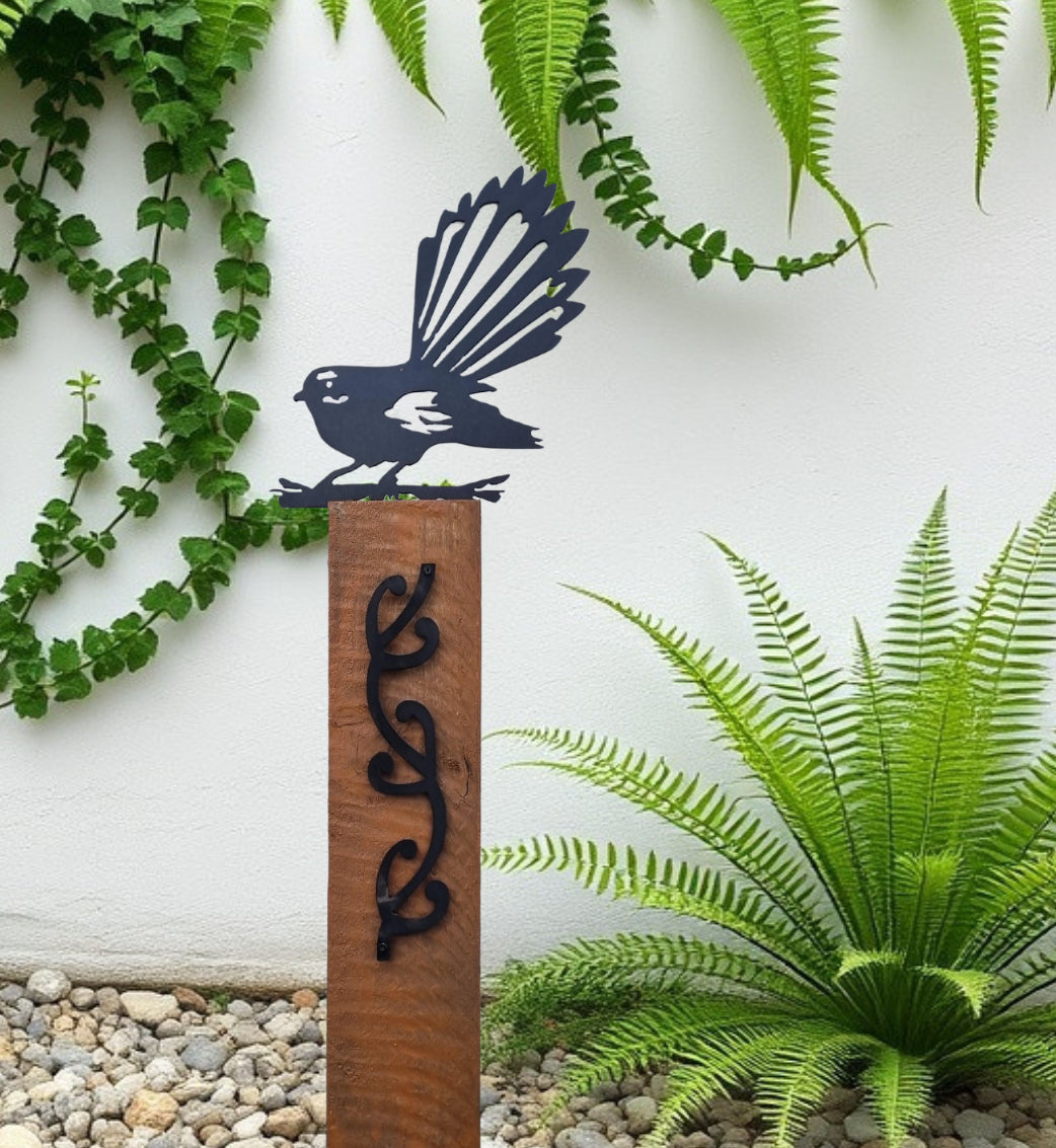 Black metal Pīwakawaka (NZ fantail) on Rustic Oak coloured Post Art-Vintique Concepts