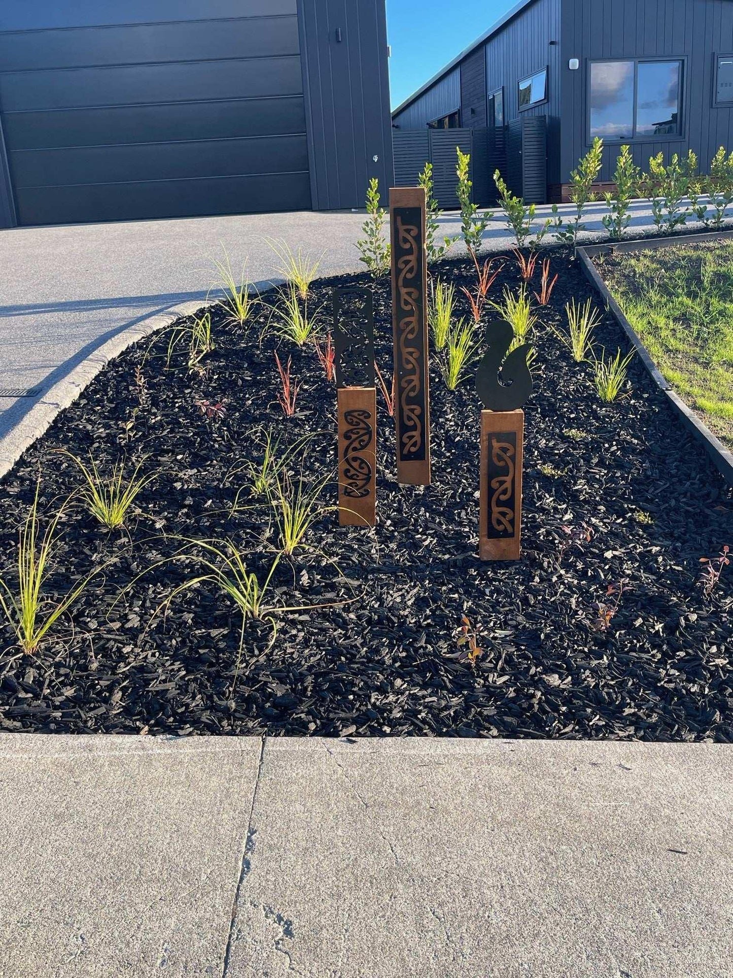 Black metal NZ Hei Matau (Fish Hook) on Rustic Oak Post-Garden Art - Vintique Concepts