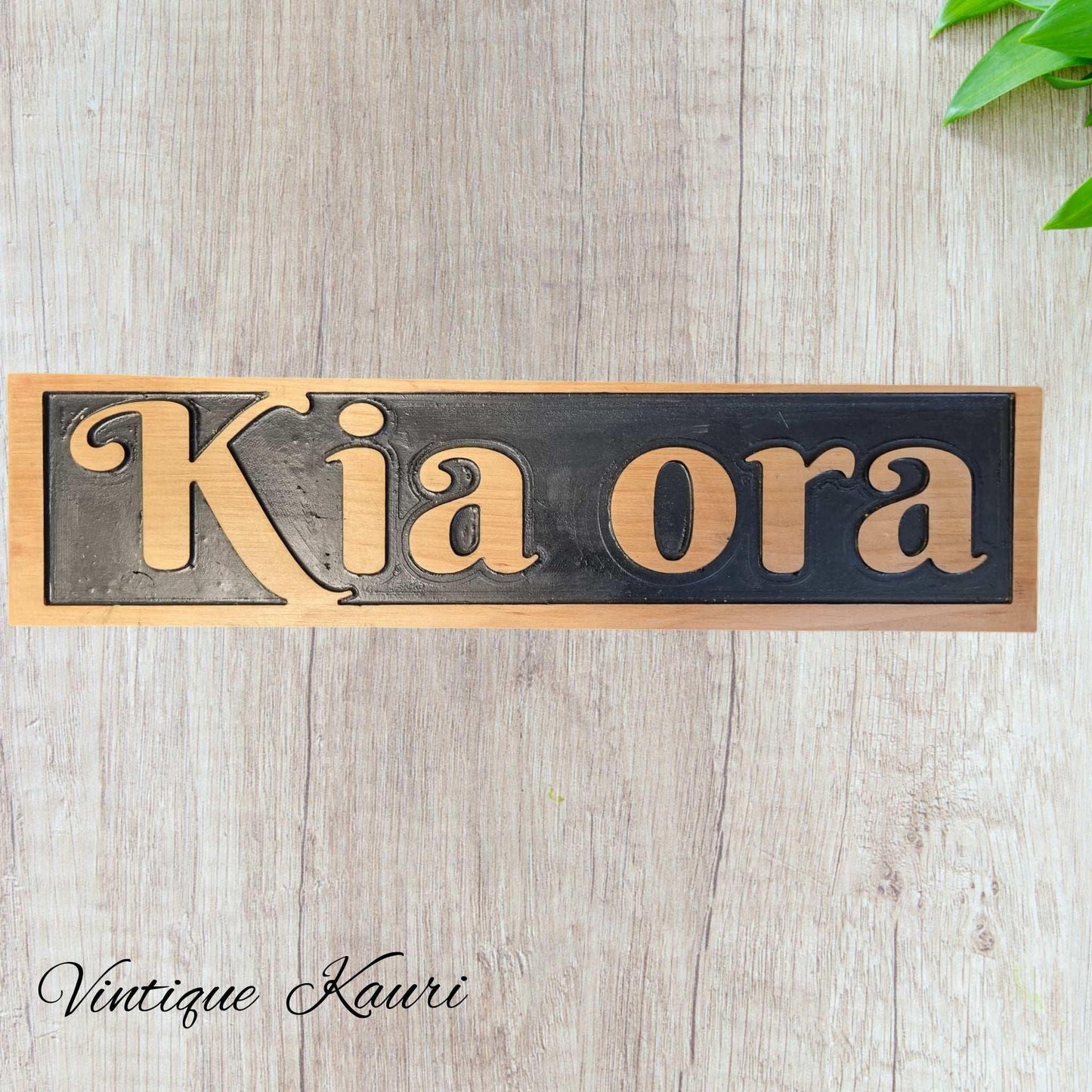 Carved wooden Kauri sign "Kia Ora" 530mm x 130mm - Vintique Concepts