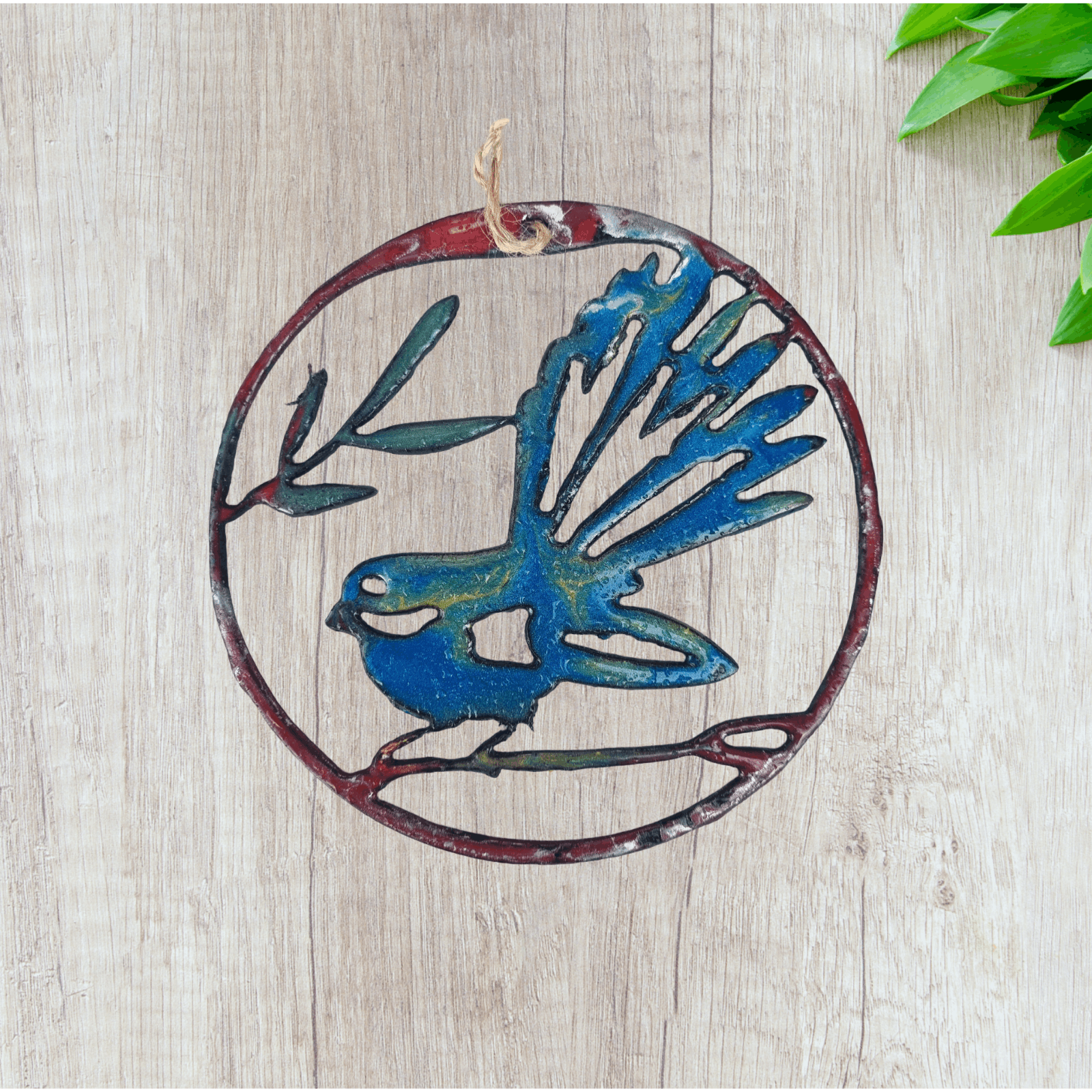 llarge fantail circle wall metal art coated in pourable epoxy 180mm dia