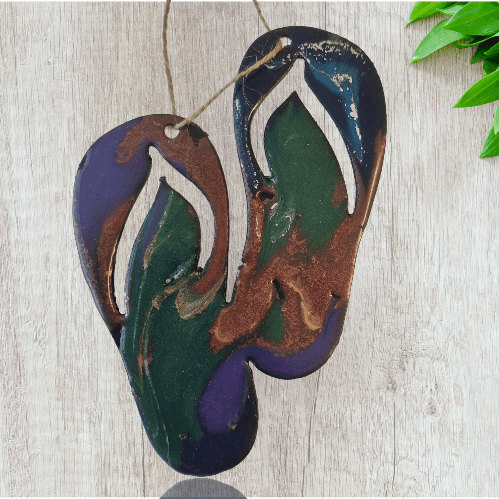 Jandals metal art coated in pourable epoxy 130,mm x 160mnm