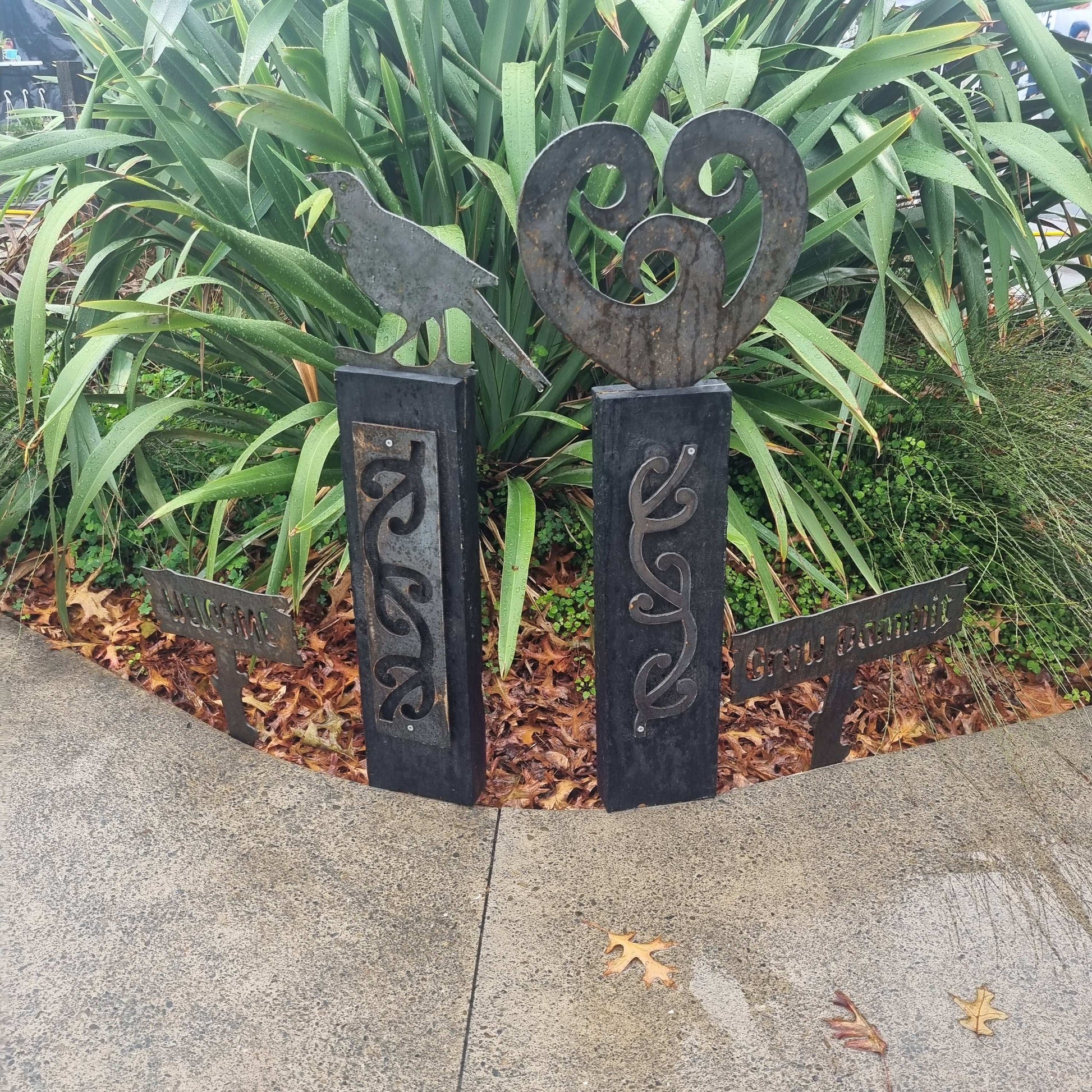 Corten koru heart on black stained Post-Garden Art
