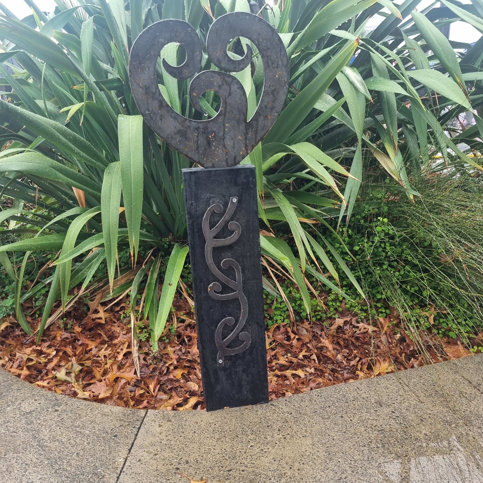 Corten koru heart on black stained Post-Garden Art