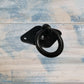 Black forged iron ring pull with a 38mm diameter, mounted on a rectangular plate, rustic design.