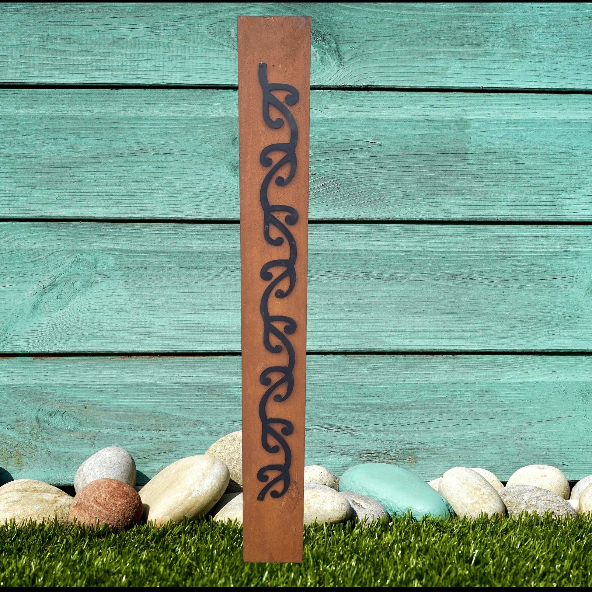 Black Metal Garden Art - Long Koru Pattern on Rustic Oak Post