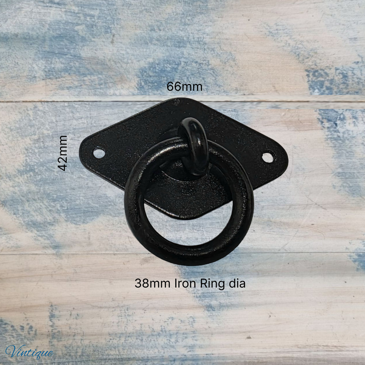 Black forged iron ring pull with a 38mm diameter ring, mounted on a diamond-shaped plate, measurements included.